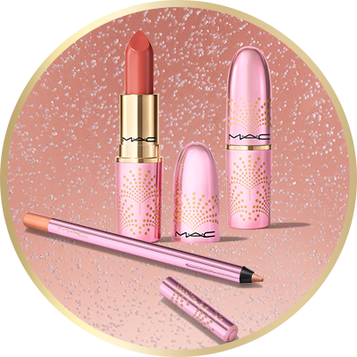 Limited edition Lustre Glass Lipstick and Powerpoint Eye Pencil over a peach bubble background